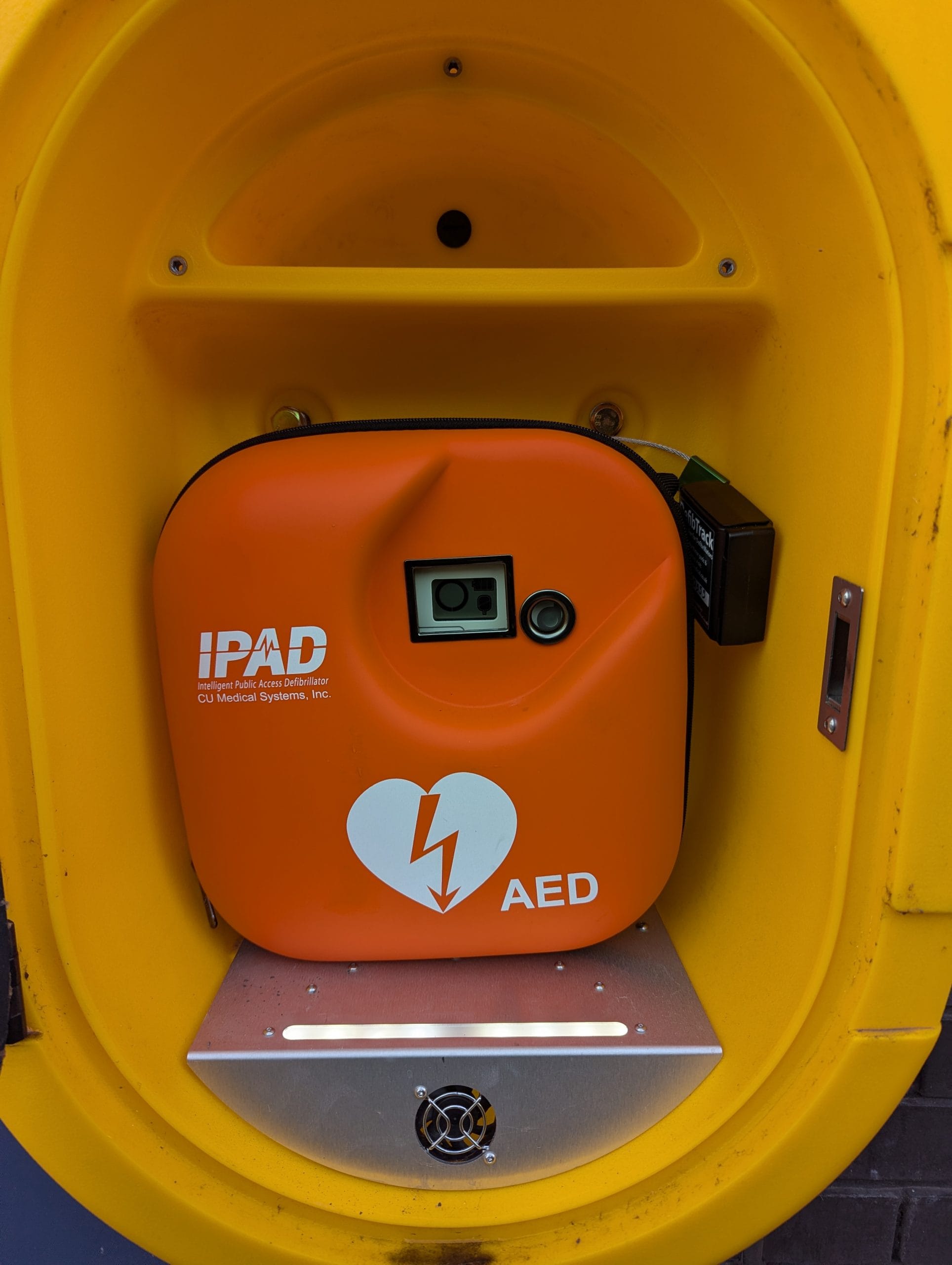 Turtle Medical DefibTrack on an AED within a public cabinet managed by the Coventry BID